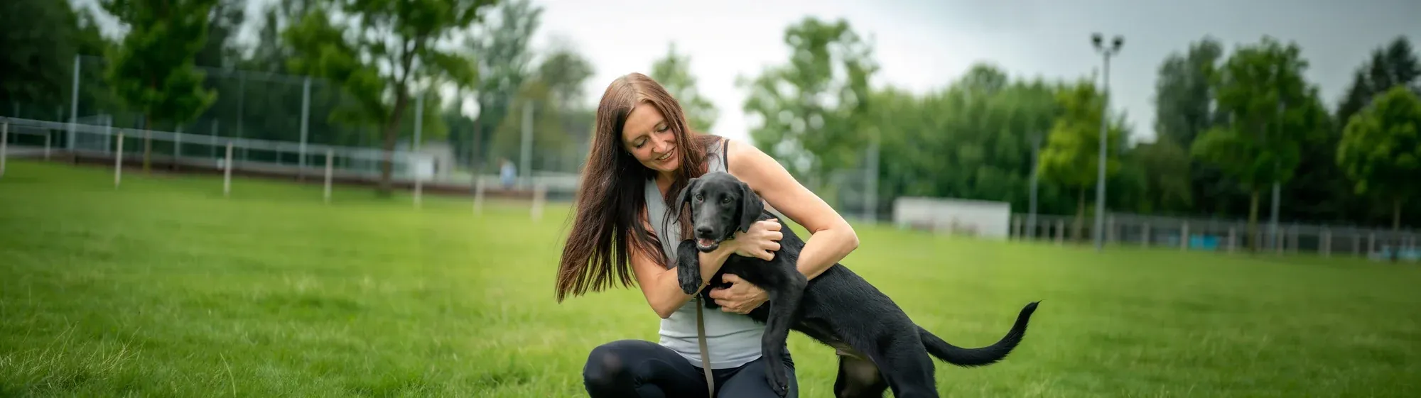 Rachel with a young black lab on the Eastern Shore